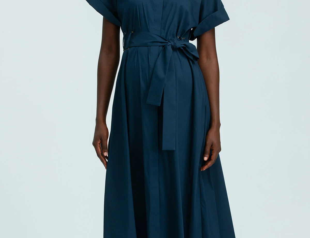 Woman wearing a blue dress on a white background