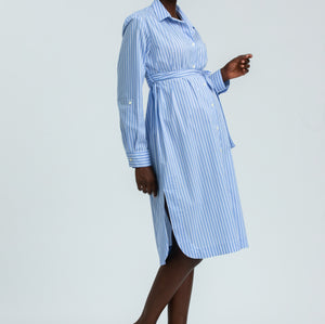Woman wearing a blue striped dress on a white background