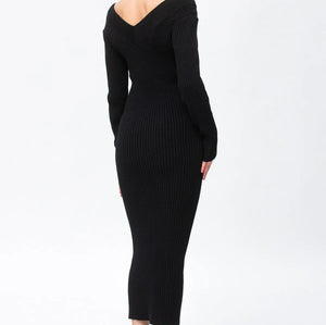 A woman modeling a black ribbed off-the-shoulder midi dress with long sleeves, shown from a side-back angle against a plain white studio background.