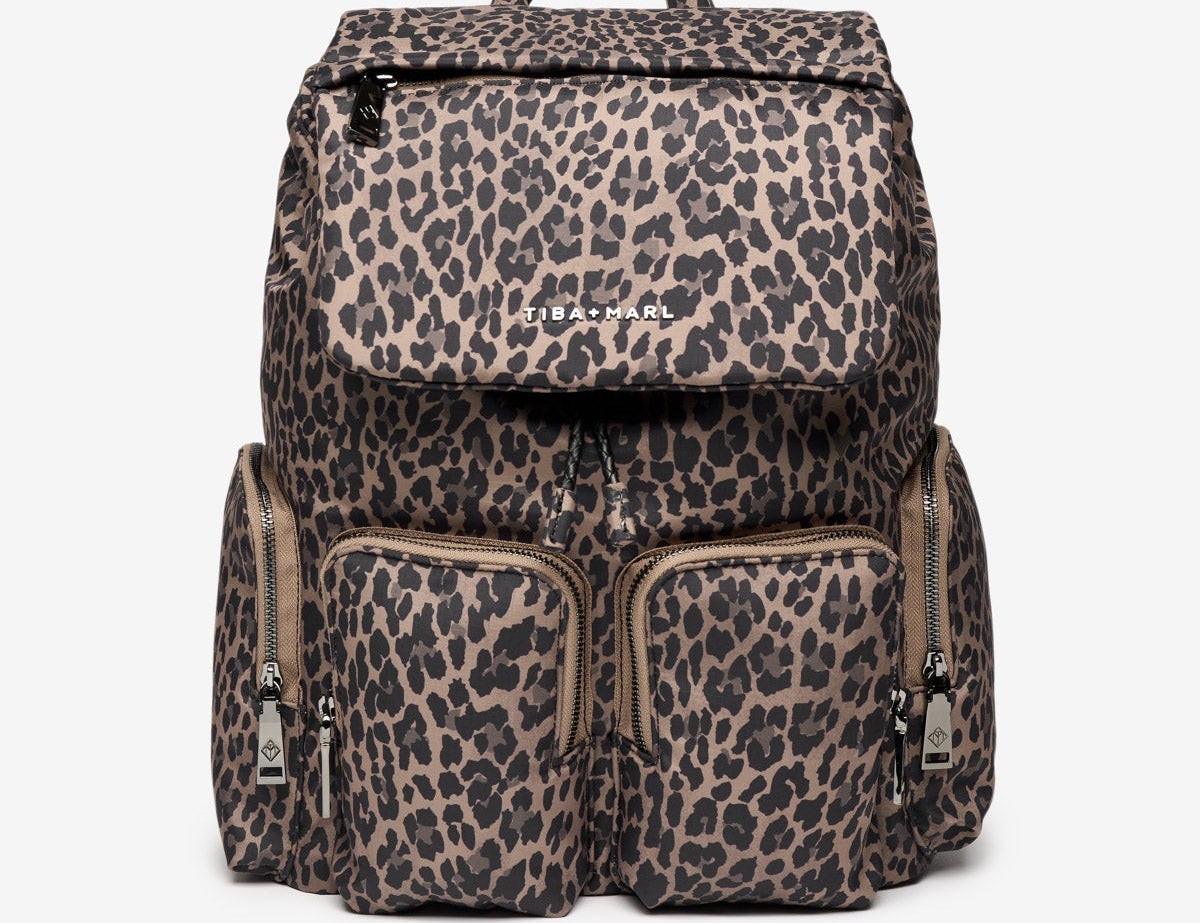Leopard print backpack with 'Teva' branding on a white background