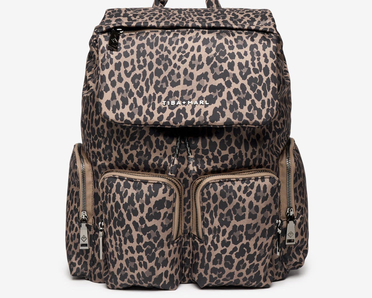 Leopard print backpack with 'Teva' branding on a white background