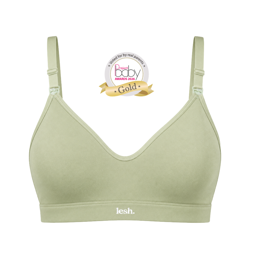 A sage green wireless baby bra by lesh. on a white background, featuring a 'Best baby Awards 2023 Gold' badge overlay near the neckline.