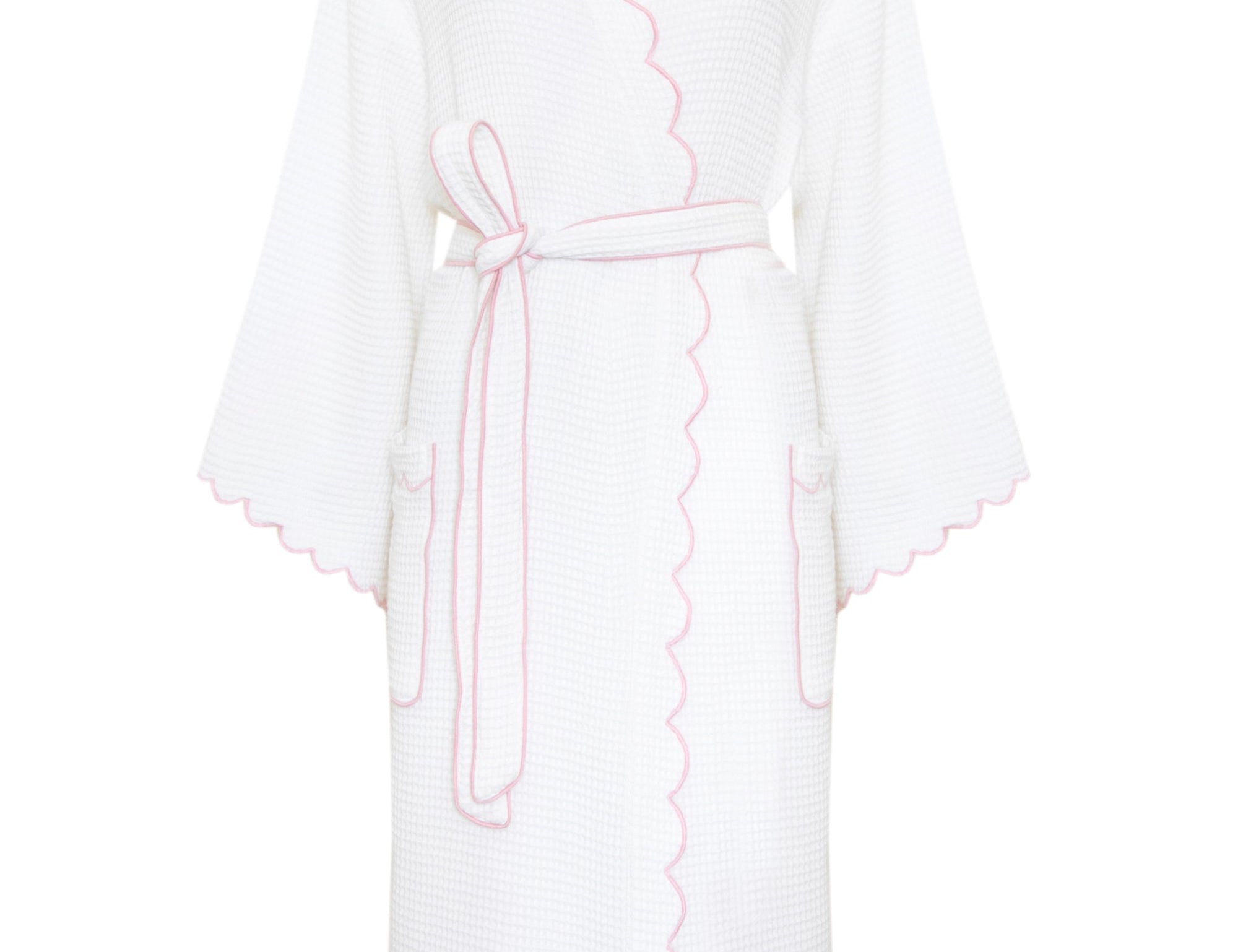 A white textured robe with pink scalloped trim, a matching tie belt, and a high collar, shown against a plain white background.