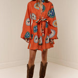Model wearing Austin Mini Dress in Orange Plates print by Palm Noosa 