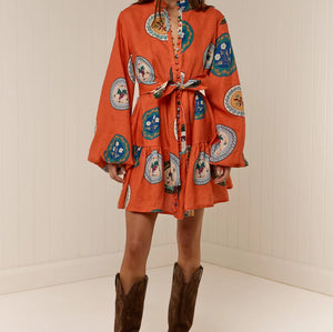 Model wearing Austin Mini Dress in Orange Plates print by Palm Noosa 