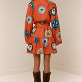 Model wearing Austin Mini Dress in Orange Plates print by Palm Noosa 
