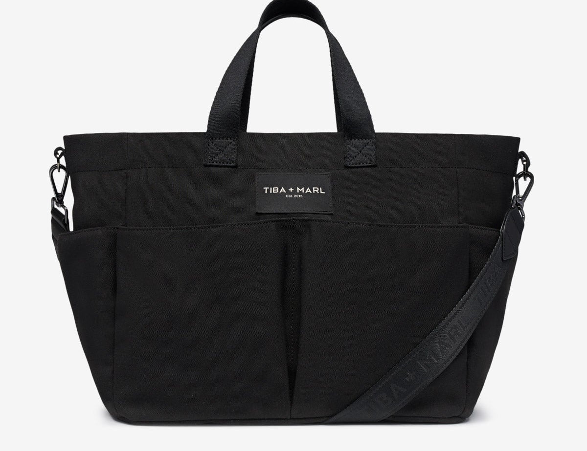 Black bag with a visible brand label on a white background