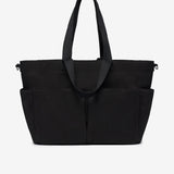 Black tote bag with multiple compartments on a white background