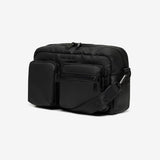 Black crossbody bag on a light gray background