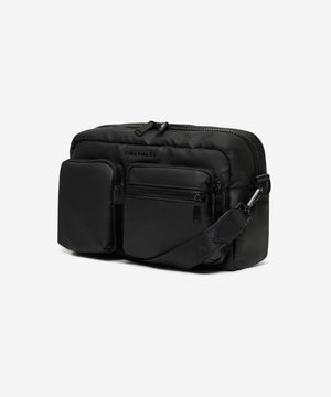 Black crossbody bag on a light gray background