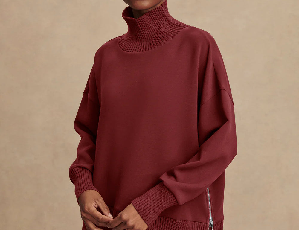 Model wearing Varley Barker high-neck oversized sweatshirt in soft DoubleSoft® fabric.