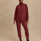 Model wearing Varley Barker high-neck oversized sweatshirt in soft DoubleSoft® fabric.