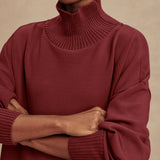 Model wearing Varley Barker high-neck oversized sweatshirt in soft DoubleSoft® fabric.