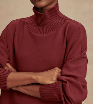 Model wearing Varley Barker high-neck oversized sweatshirt in soft DoubleSoft® fabric.
