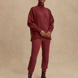 Model wearing Varley Barker high-neck oversized sweatshirt in soft DoubleSoft® fabric.