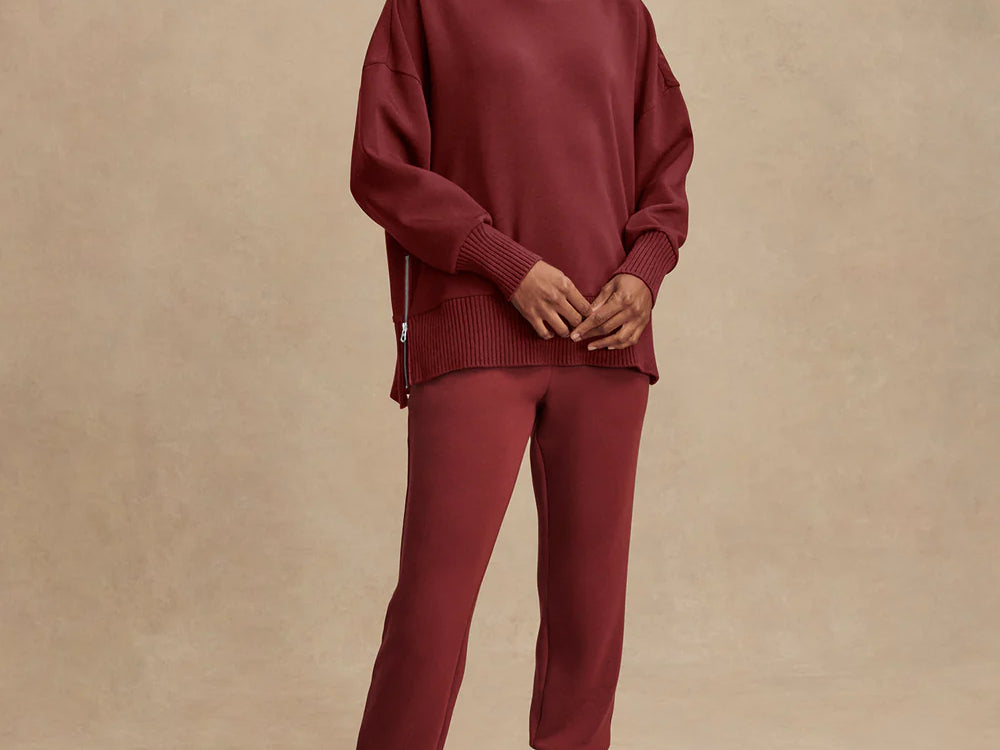 Model wearing Varley Barker high-neck oversized sweatshirt in soft DoubleSoft® fabric.