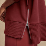 Model wearing Varley Barker high-neck oversized sweatshirt in soft DoubleSoft® fabric.