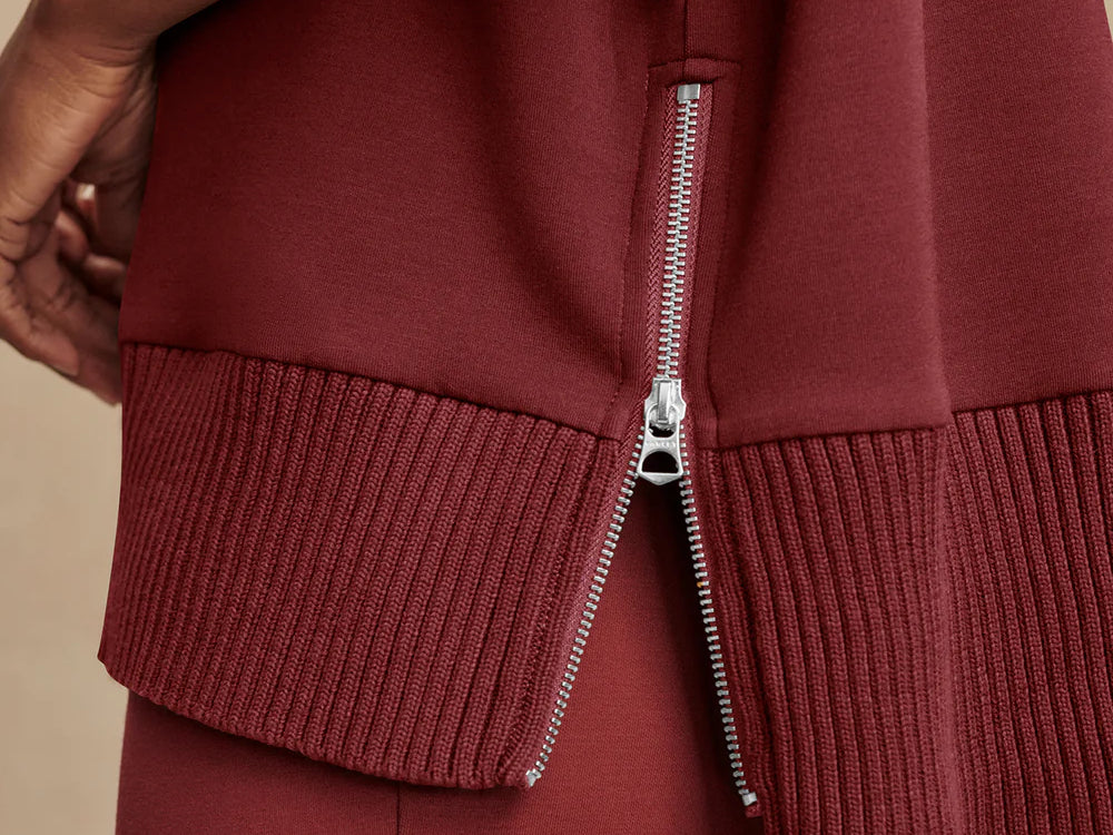 Model wearing Varley Barker high-neck oversized sweatshirt in soft DoubleSoft® fabric.