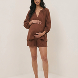 pregnant woman wearing nobodys child blouse
