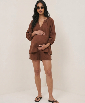 pregnant woman wearing nobodys child blouse
