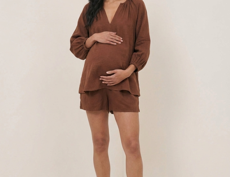 pregnant woman wearing nobodys child blouse
