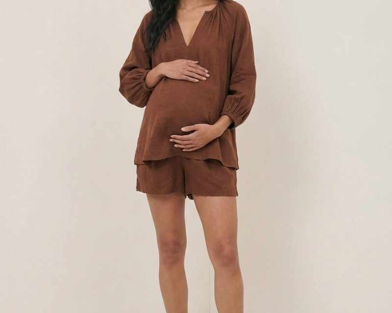 pregnant woman wearing nobodys child blouse
