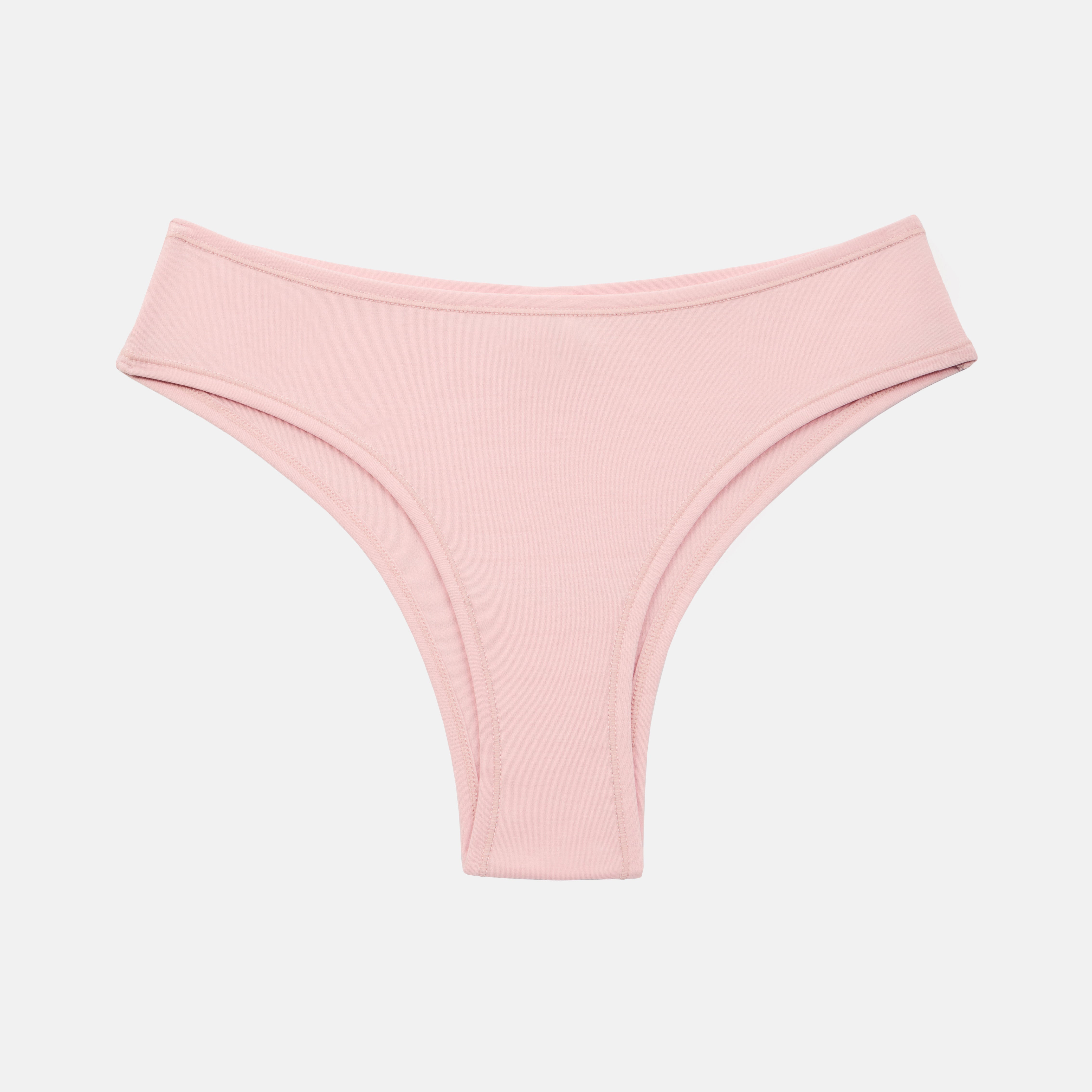 A pair of light pink low-rise bikini bottoms with a wide waistband, shown flat against a light gray background.