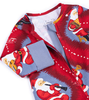 A close-up of a Christmas-themed zip-up pajama or long-sleeve top by Chelsea 1965, featuring a red and blue print of Santa Claus playing musical instruments, with a solid blue cuff.