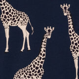 A close-up of a navy blue fabric with a repeating pattern of cream giraffes.