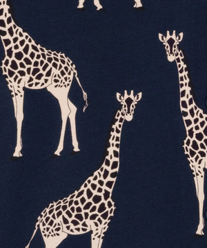 A close-up of a navy blue fabric with a repeating pattern of cream giraffes.
