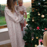 Baby Organic Cotton Nightie, Cordelia Toile: adult holding a baby in the nightie beside a Christmas tree, child hanging a bauble