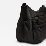 A black nylon hobo bag with a drawstring front pocket and a zippered side pocket, shown on a clean white background.