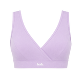 A light purple/lavender sports bra with a crossover wrap front and a wide underband featuring the white 'lesh.' logo, shown against a plain white background.