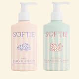 Two bottles of SOFTIE baby products on a light beige background