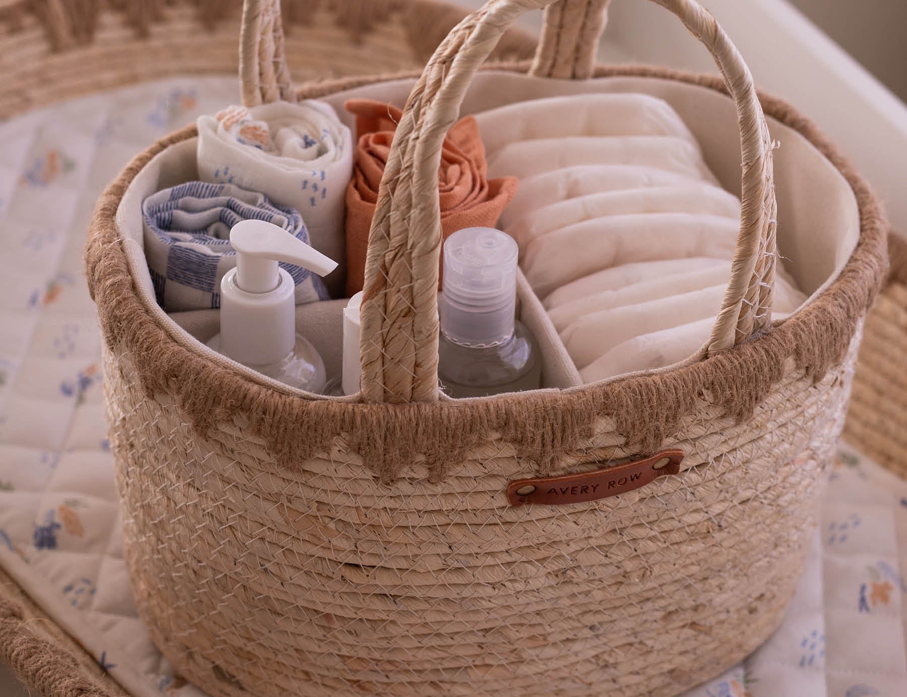 Woven basket with baby items on a crib