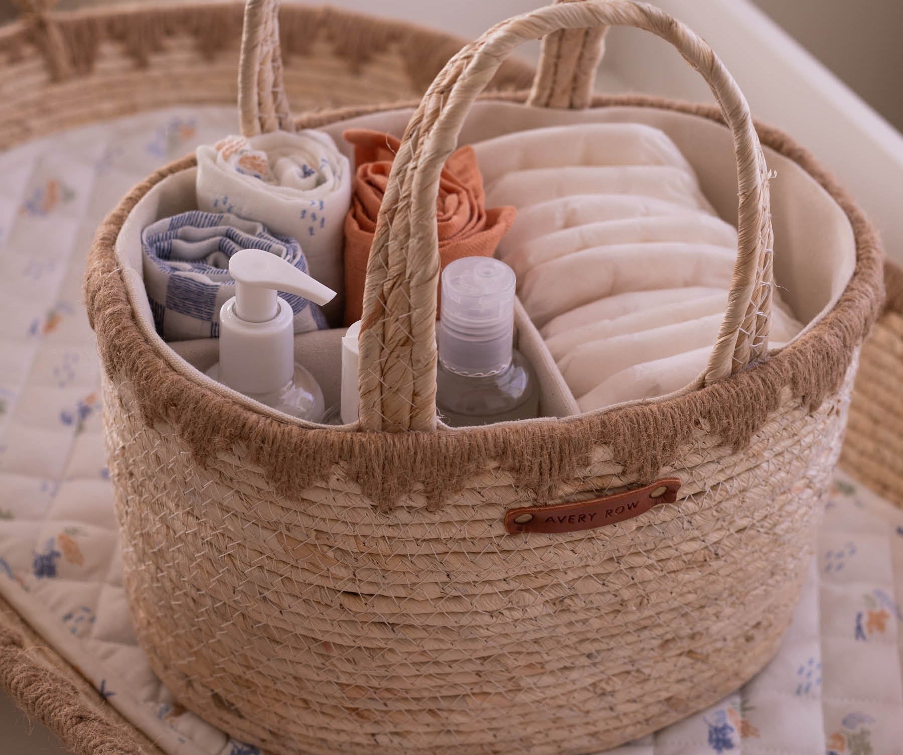 Woven basket with baby items on a crib