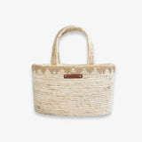 Woven handbag with a handle on a white background