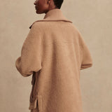 Model wearing Varley Eleanor Patch Pocket Fleece in soft borg fabric with DoubleSoft® trims and front zip.