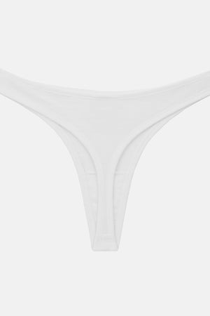A white ribbed thong bikini bottom laid flat against a light gray background.
