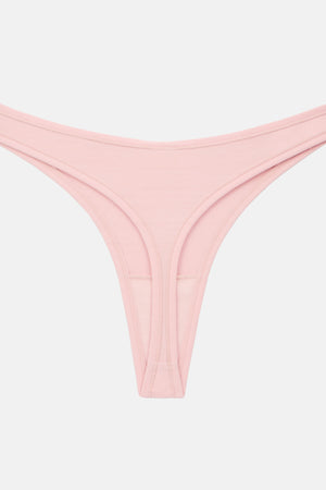 A light pink ribbed thong-style bikini bottom with a wide waistband and minimal side straps, shown flat against a light gray background.