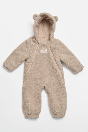 ALF Eco Pramsuit in beige, front view laid flat showing the hood with bear ears, diagonal zip and cuffed legs