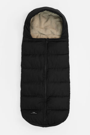 Alma Eco Universal Quilted Footmuff Black, front view laid flat with centre zip and cream fleece-lined hood