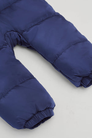 Anders Eco Snowsuit Navy, close-up of the quilted legs and elasticated footless cuffs