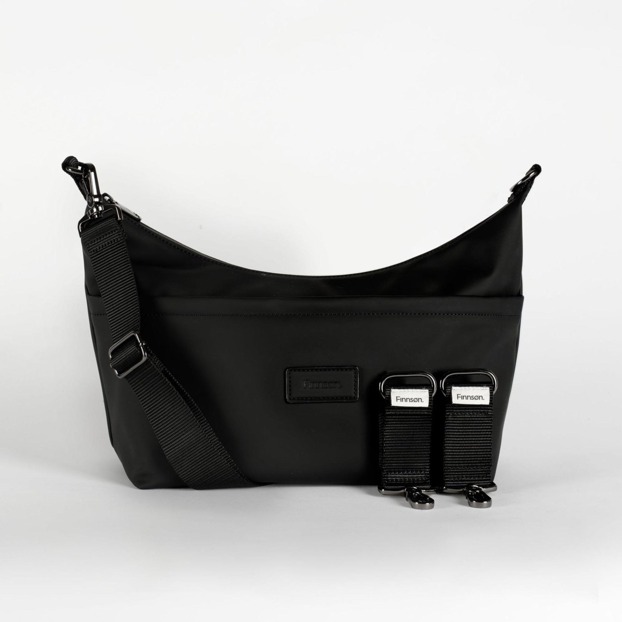 Fia Eco Stroller Organiser Black, front view with shoulder strap attached and two stroller clips laid beside it