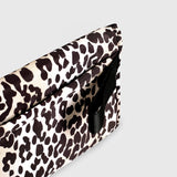 Oslo Eco Travel Changing Mat in Leopard, close-up of the black strap loop on the side of the folded mat