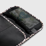 Oslo Eco Travel Changing Mat in Leopard, close-up of the open black mesh pocket with items inside