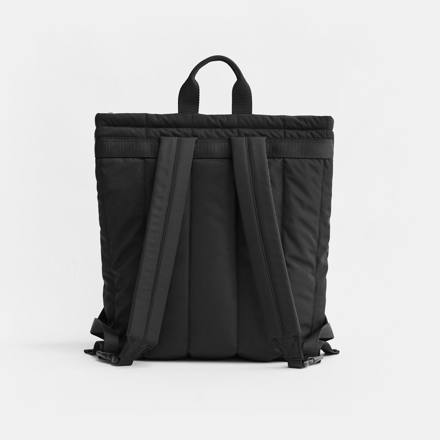 A black backpack shown from the back, featuring padded side pockets, a top carry handle, and wide shoulder straps, photographed against a clean white studio background.