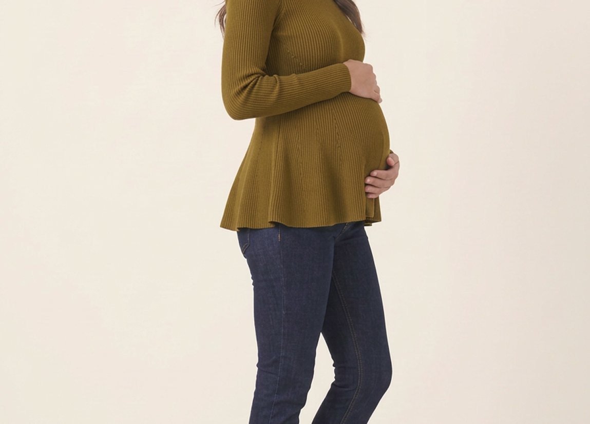 Rib Knit Peplum Khaki Jumper side view on a smiling pregnant woman holding her bump, with dark jeans