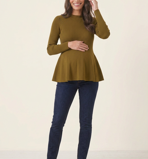 Rib Knit Peplum Khaki Jumper full-length front view, woman smiling with one hand on her bump and one touching her hair