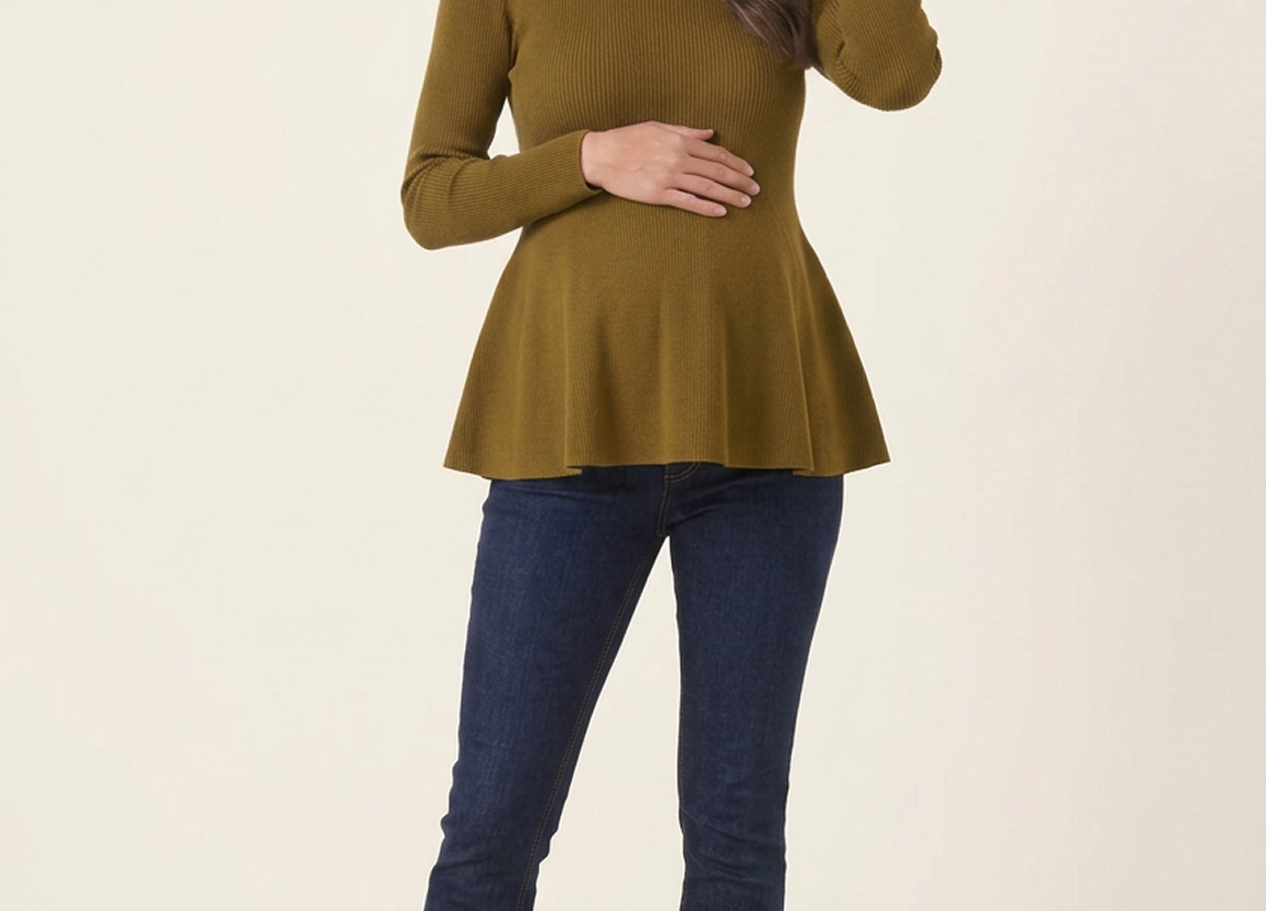 Rib Knit Peplum Khaki Jumper full-length front view, woman smiling with one hand on her bump and one touching her hair